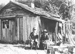 Image: Couple in Front of Cabin